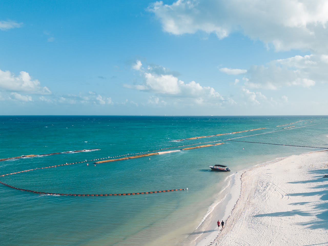 An aerial view of Playa del Carmens stunning coastline with turquoise waters and sandy beaches.